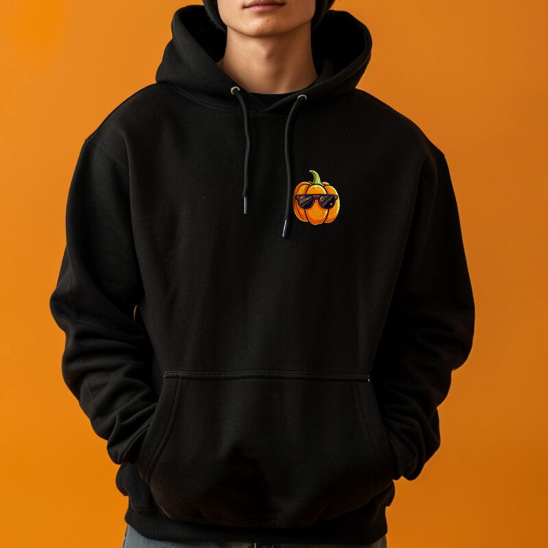 A person wearing a Halloween hoodie with a playful pumpkin wearing sunglasses design.