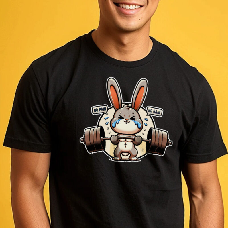 A person wearing a motivational tshirt with a graphic of a determined cartoon bunny lifting weights. The shirt's design includes the motivational phrase "NO PAIN NO GAIN" in bold lettering encircling the bunny.